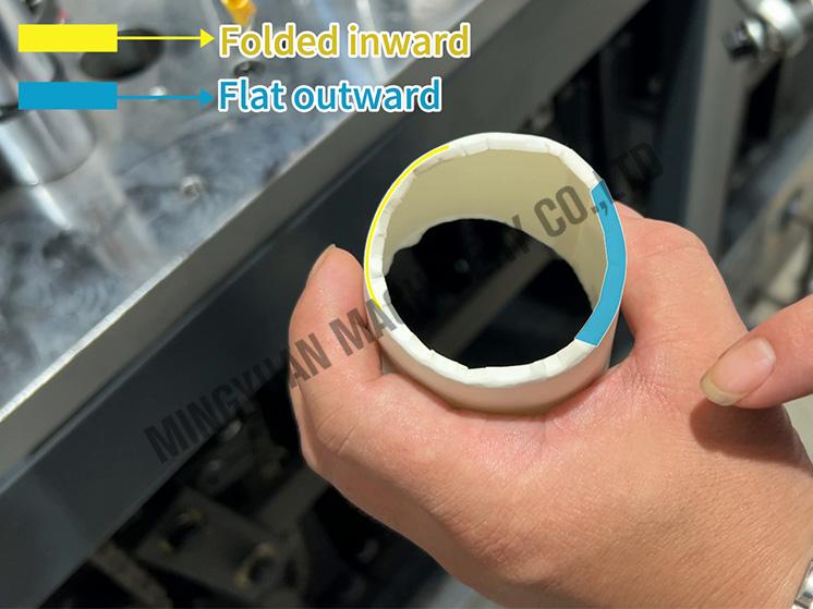 The bottom of the paper cup is unevenly folded and needs to be adjusted