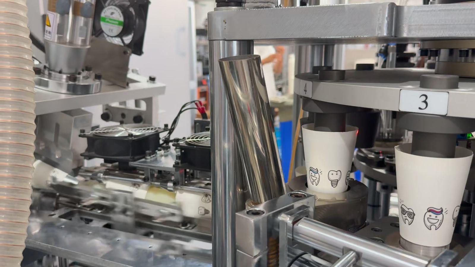 Printed 5 oz cups on the forming stations of the running MYC-160SM