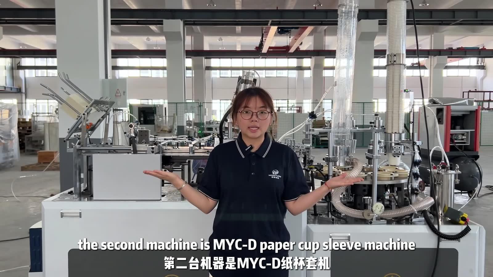 Presenter introducing the MYC-D Cup Sleeve Machine for Kenya