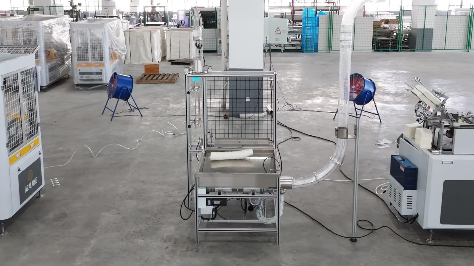 Transfer station between the two machines in the Kenya cup line