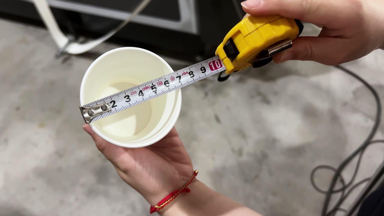 Tape measurement of the 7 cm rim on the Armenian paper cup